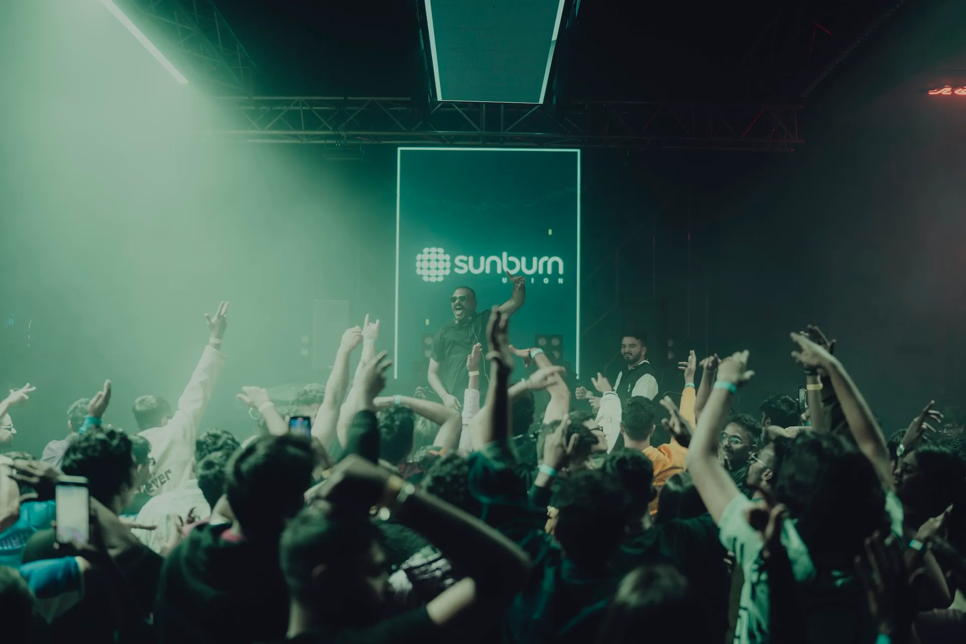 Hands up in the crowd at a Raka Ashok set